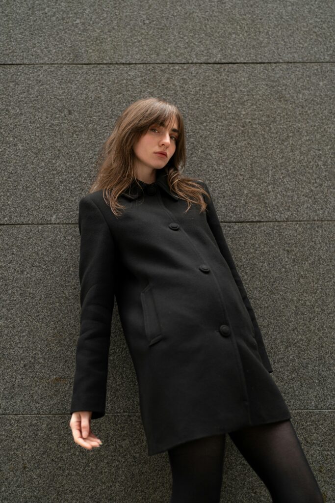 Women wearing black desinger coat